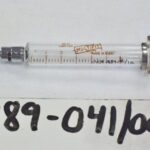 1989-041/001a-b - Syringe, Medical