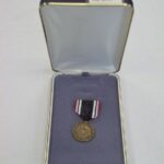 1992-017/001a-c - Medal