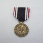 1992-017/001a-c - Medal
